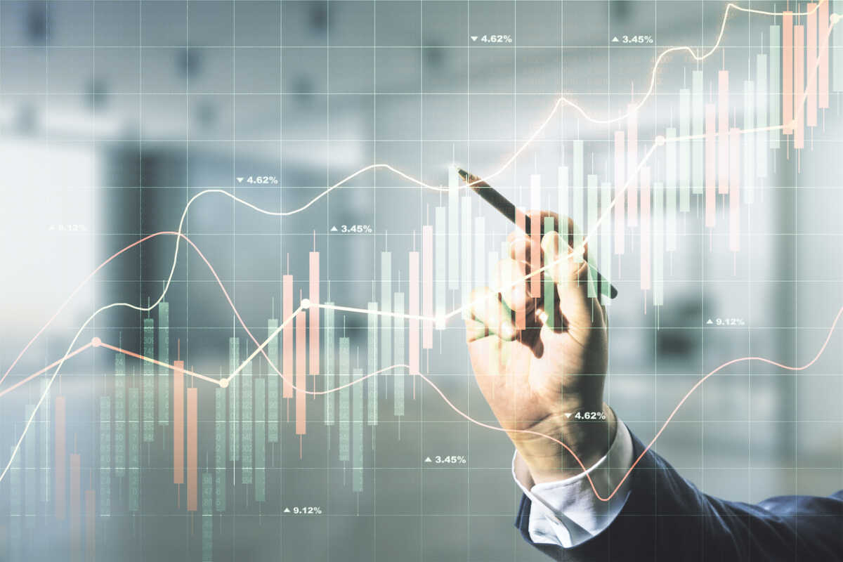 Multi exposure of analyst hand with pen working with virtual abstract financial diagram on blurred office background, banking and accounting concept